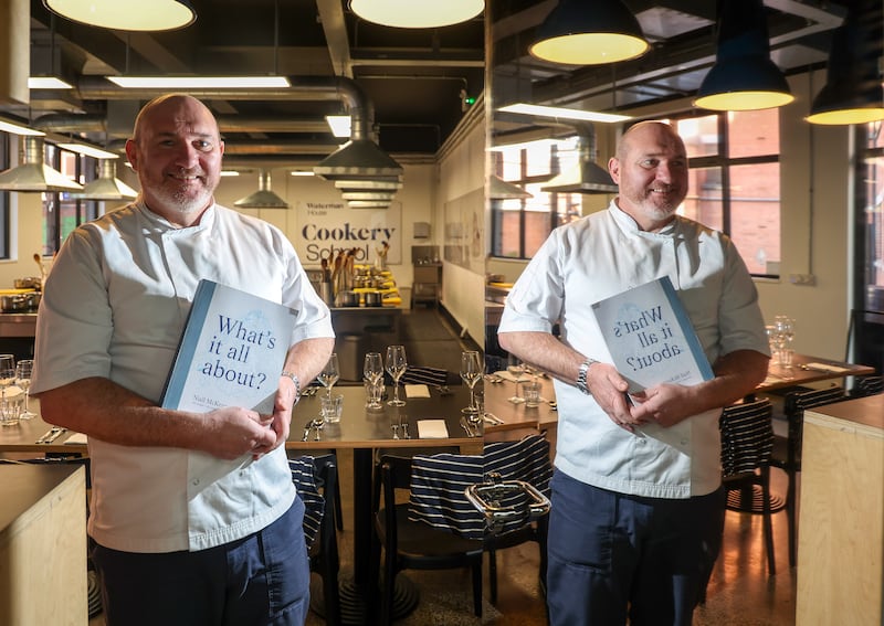 Belfast restaurateur Niall McKenna with his new book. PICTURE: MAL MCCANN