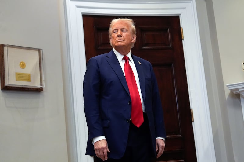 President Donald Trump listens in the Roosevelt Room at the White House (Julia Demaree Nikhinson/AP)