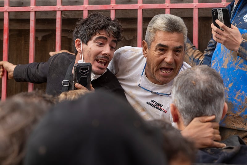 King Felipe VI was confronted by angry people from the devastated town of Paiporta, near Valencia (AP)