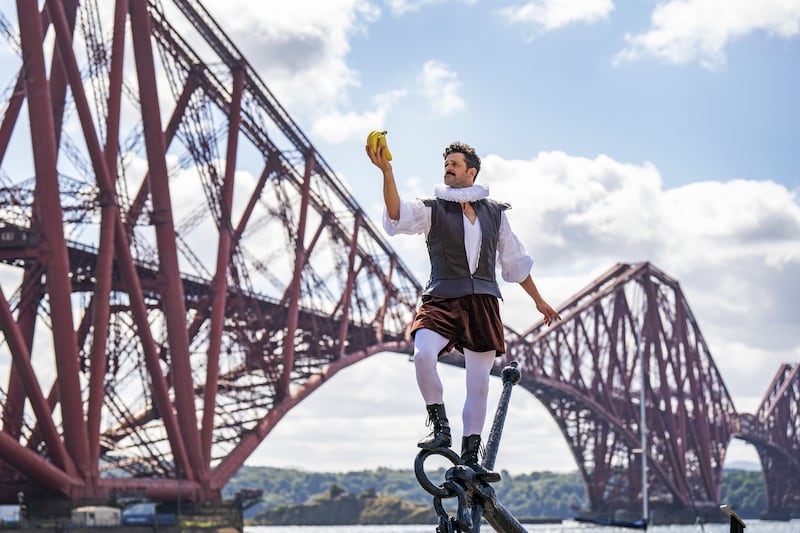 Fringe performer Garry Starr poses in front of the Forth Bridge