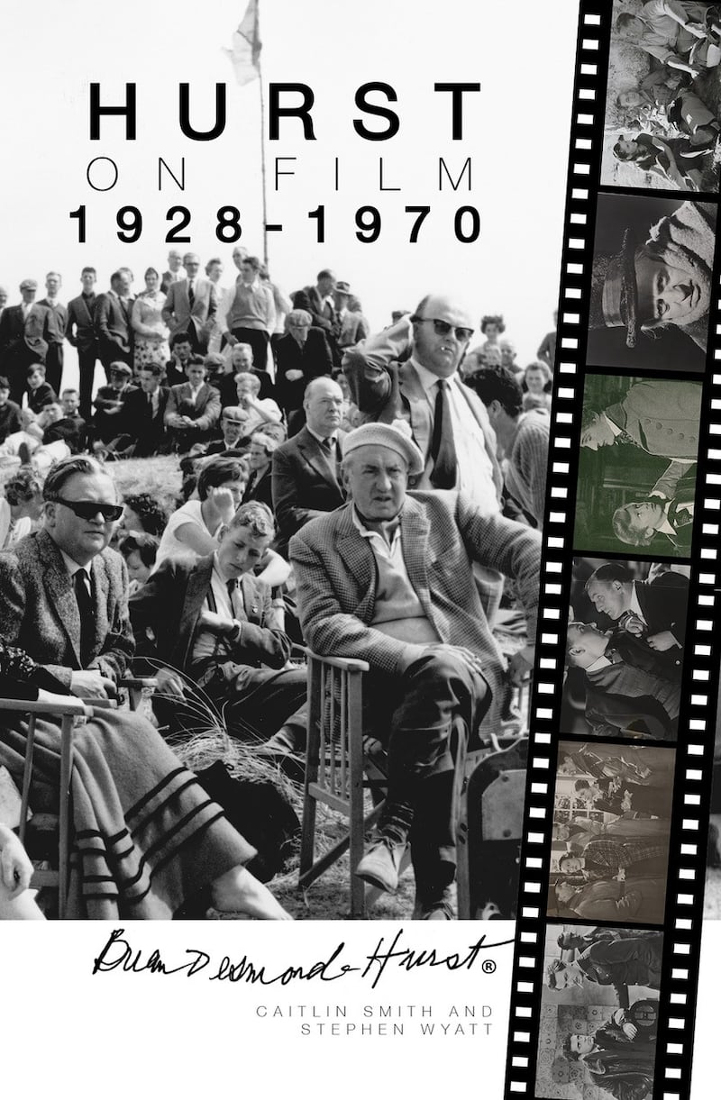 Black and white image of the front cover of the book Hurst on Film 1928-1970. Showing Hurst sitting on a directors chair with lots of people sitting behind him.