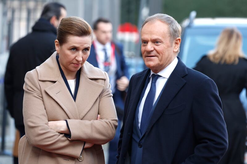 Denmark’s Prime Minister Mette Frederiksen speaks with Polish counterpart Donald Tusk at a summit in Brussels (Geert Vanden Wijngaert/AP)