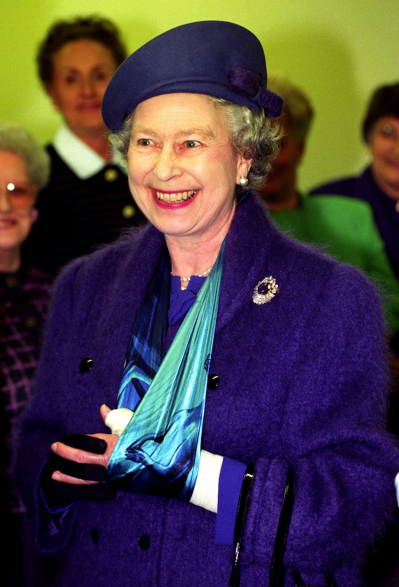 The Queen with her arm in a sling after she was injured as she fell from a horse in 1994