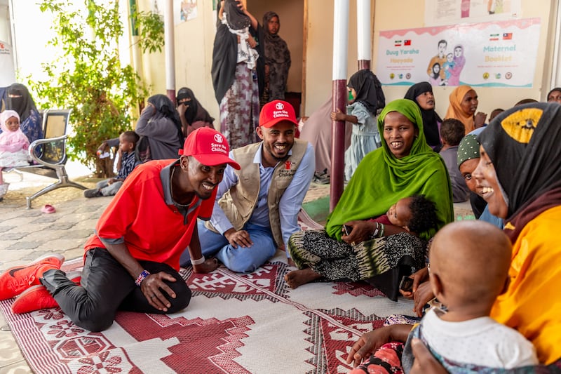 Sir Mo Farah on a visit to a health centre (Save The Children)