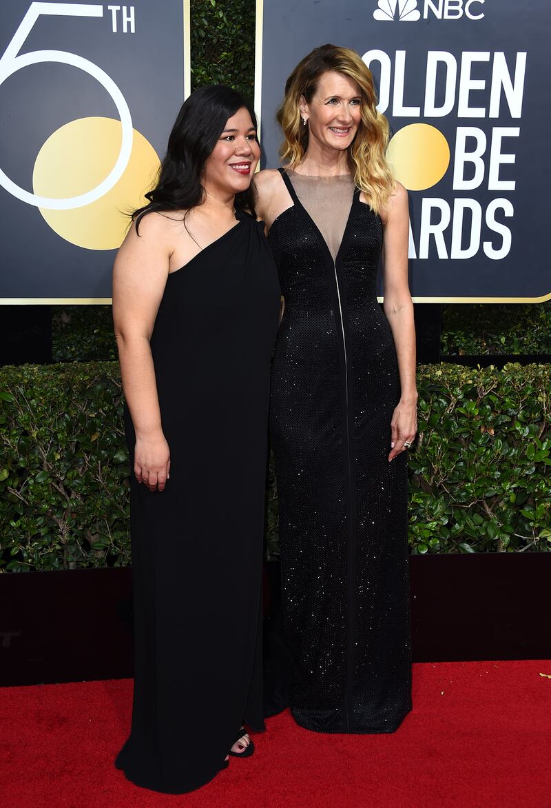 Monica Ramirez, left, and Laura Dern arrive at the 75th annual Golden Globe Awards (Jordan Strauss/Invision/AP)