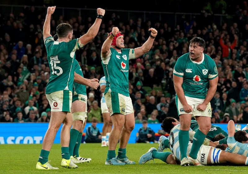 Ireland players celebrate after holding off an Argentina fightback to claim victory