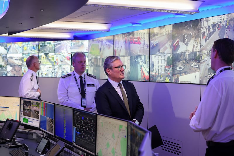 Sir Keir Starmer (third from left), pictured at the Metropolitan Police Command and Control Special Operations Room at Lambeth Police Headquarters