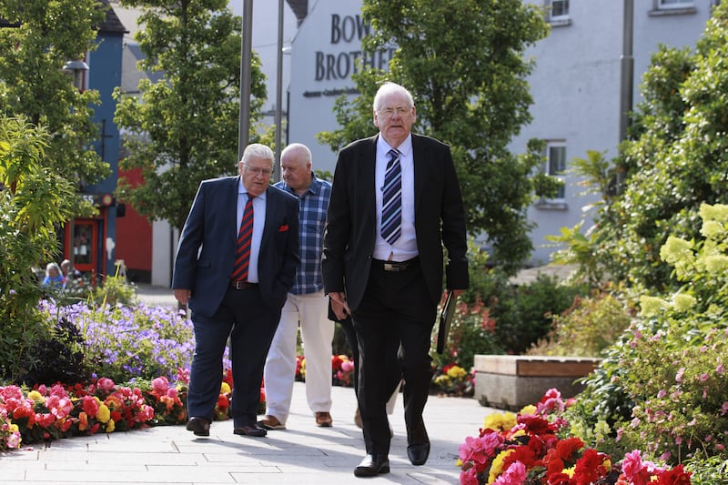 Omagh bomb campaigners Stanley McCombe, left, who lost his wife, Ann; and Michael Gallagher, right, who lost his son, Aiden, arriving at the Strule Arts Centre in Omagh