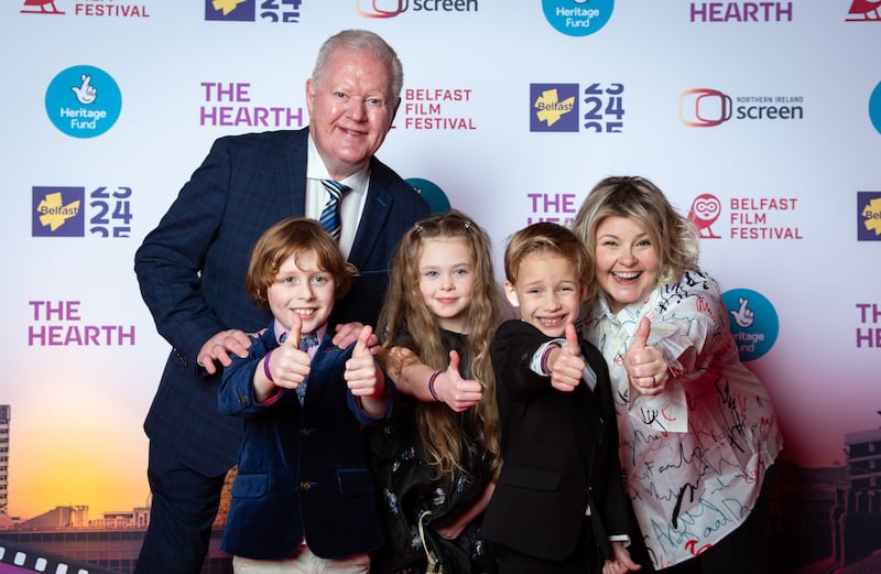 Hosts of The Hearth gala screening Julian Simmons and Tara Lynne O'Neill with pupils from St Bride's PS in Belfast who appeared in the film