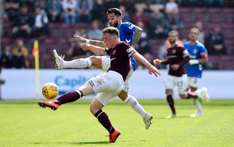 Rangers' Daniel Candeias (back) and Hearts' Bobby Burns battle for the ball during the Ladbrokes Scottish Premiership match at Tynecastle Stadium, Edinburgh.