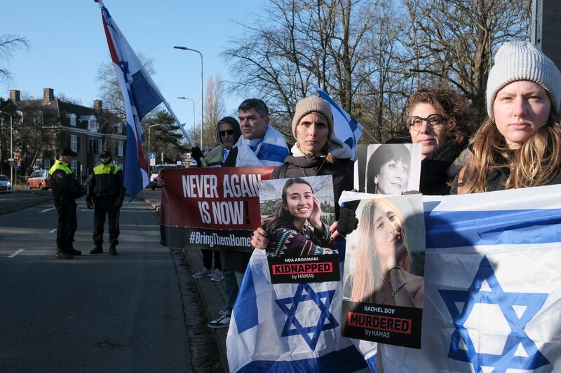 Pro-Israel activists gather near the International Court of Justice in The Hague (Patrick Post/AP)