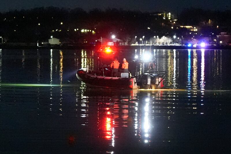 A boat works at the scene near Ronald Reagan Washington National Airport (Alex Brandon/AP)