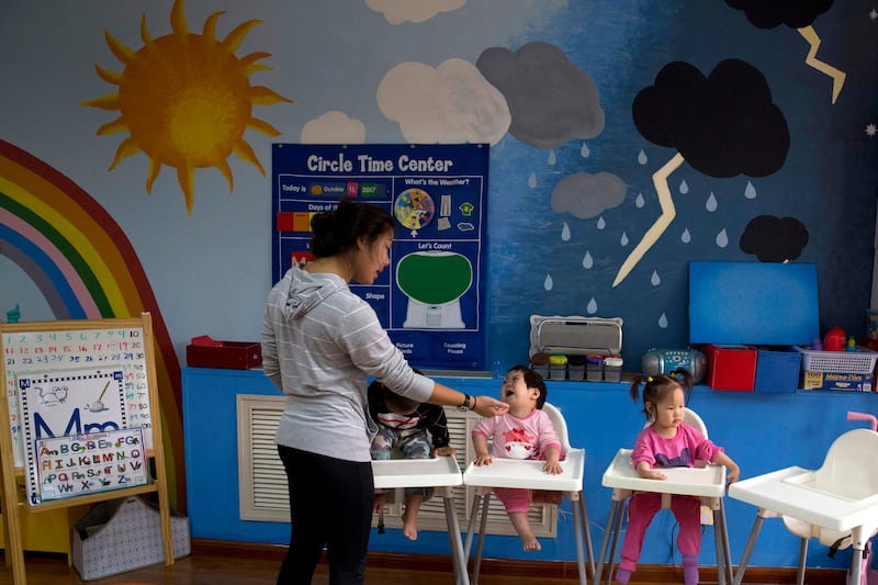 Children attend classes at a foster home of the New Hope Foundation on the outskirts of Beijing, China (Ng Han Guan/AP)