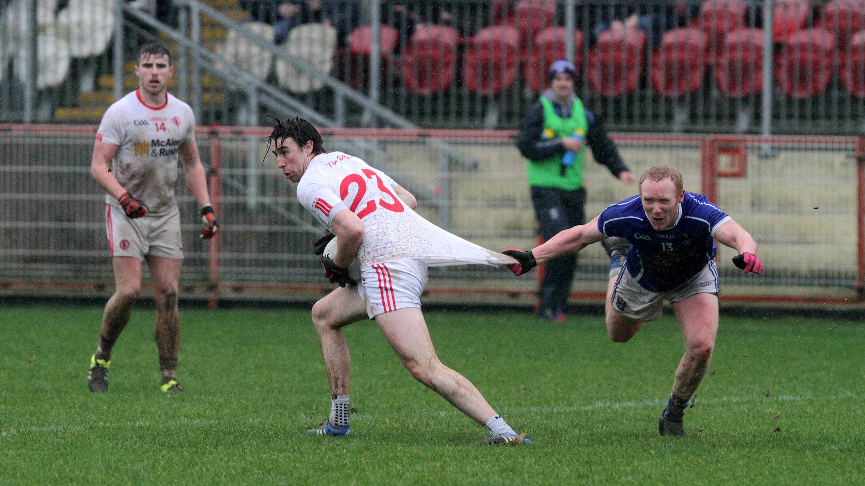 Cavan's Cian Mackey gets to grips with Tyrone's Conall McCann during their Division Two match at Healy Park