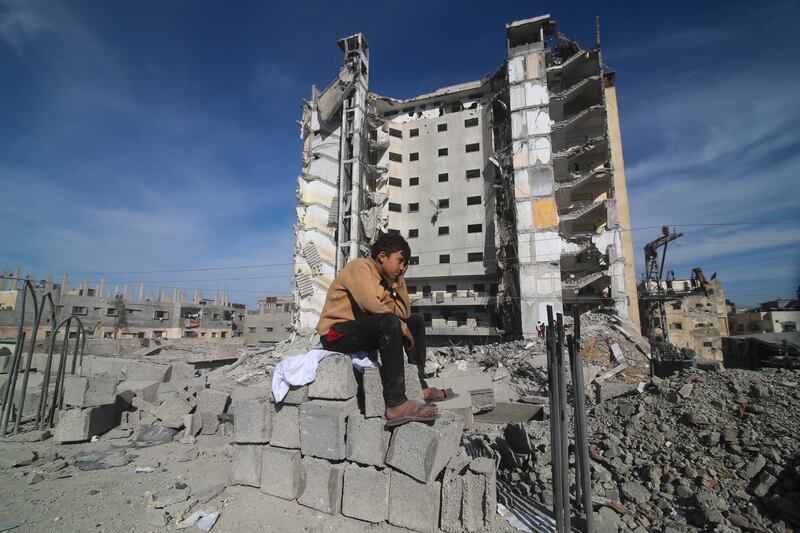 A residential building destroyed in an Israeli strike in Rafah (Hatem Ali/AP)