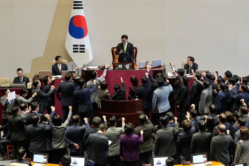 Politicians of the ruling People Power Party protest to South Korea’s National Assembly Speaker Woo Won Shik (Ahn Young-joon/AP)