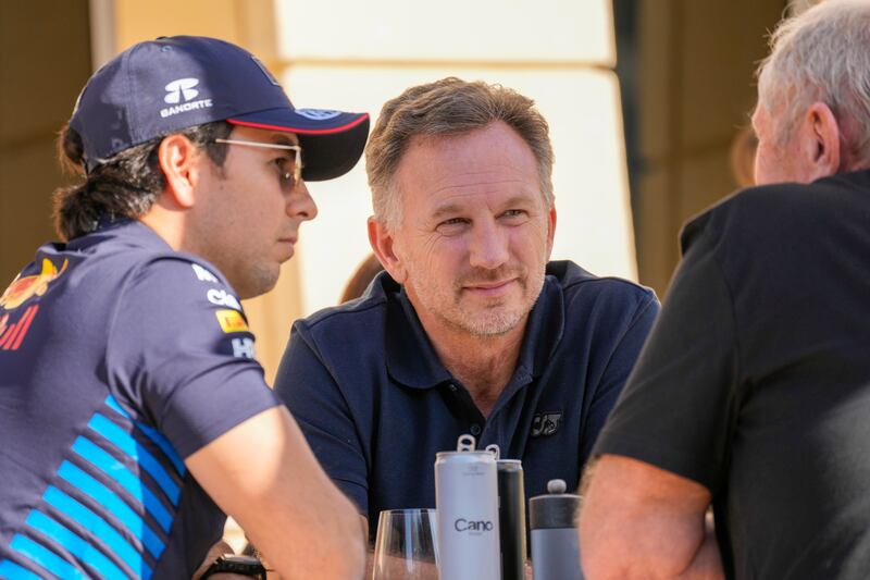 Christian Horner, pictured (centre) in Bahrain on Wednesday, denies the accusations (Darko Bandic/AP)