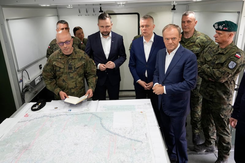 Poland’s Prime Minister Donald Tusk says its forces would fortify the border with Belarus after a soldier was killed (Czarek Sokolowski/AP)