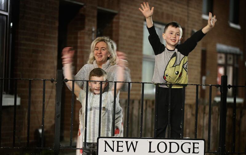 People in Belfast taking part in applauding carers and NHS workers last night. Picture by Hugh Russell&nbsp;