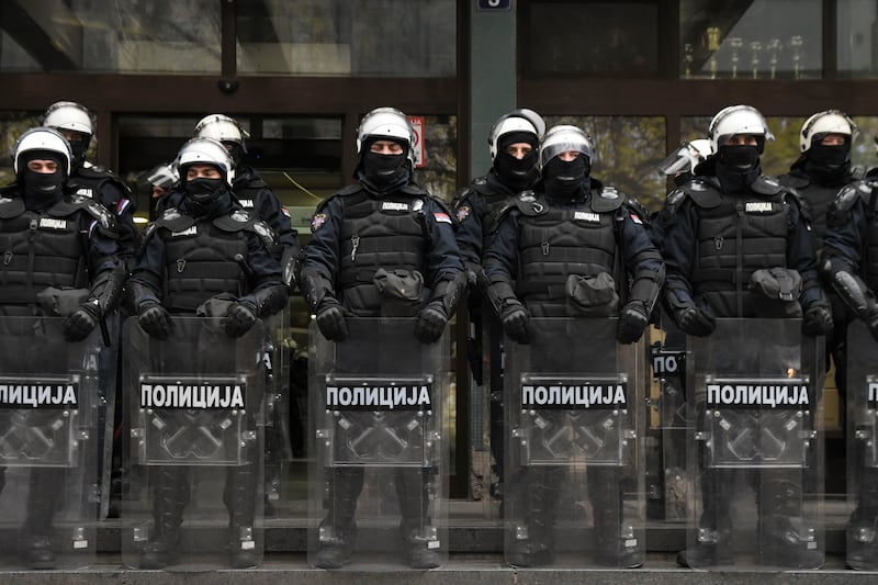 Serbian police officers guarded the courthouse during a protest demanding arrests over a deadly roof collapse at a railway station in Novi Sad (AP)