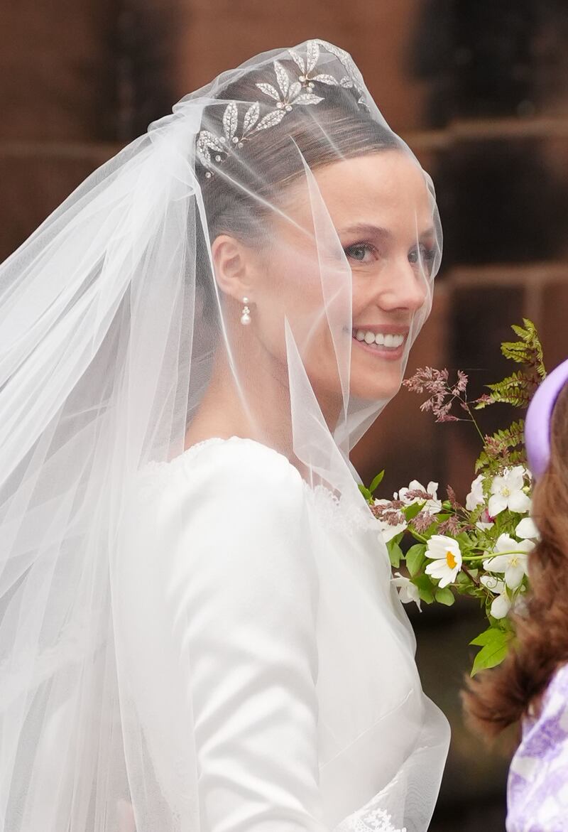 Olivia Henson, wearing a family tiara, arriving at Chester Cathedral for her wedding to Hugh Grosvenor, the Duke of Westminster