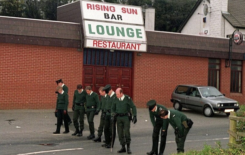 Police at the Rising Sun bar in Greysteel on the morning after eight people were shot dead in 1993. Picture: Pacemaker