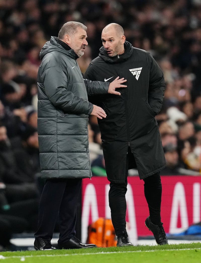 Tottenham manager Ange Postecoglou makes his point to fourth official Tim Robinson