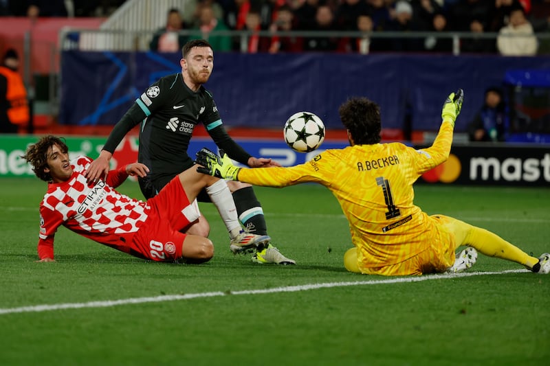 Goalkeeper Alisson Becker kept a clean sheet in his first appearance for two months (Joan Monfort/AP)