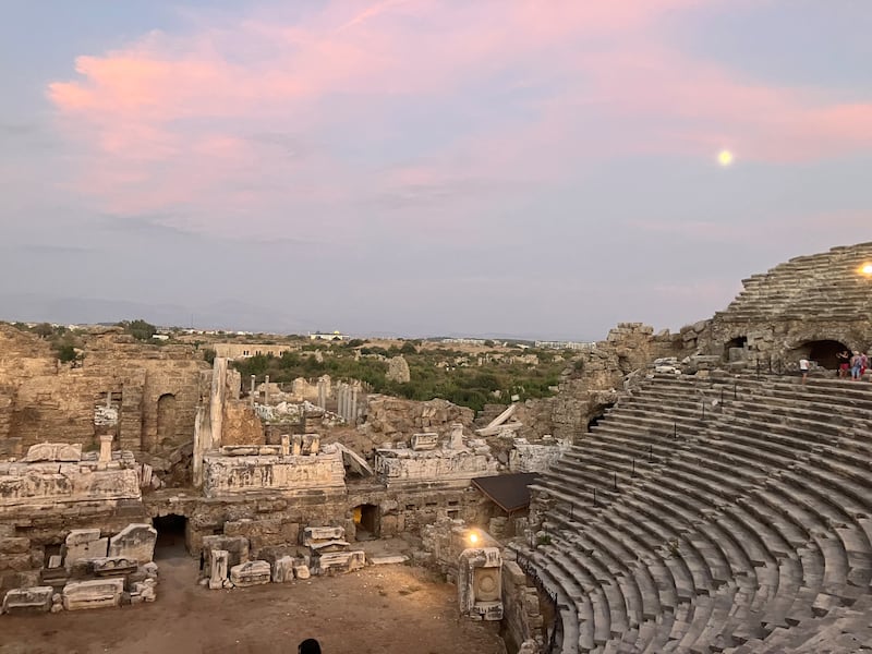 Exploring the ruins of the ancient Greek theatre at Side during sunset