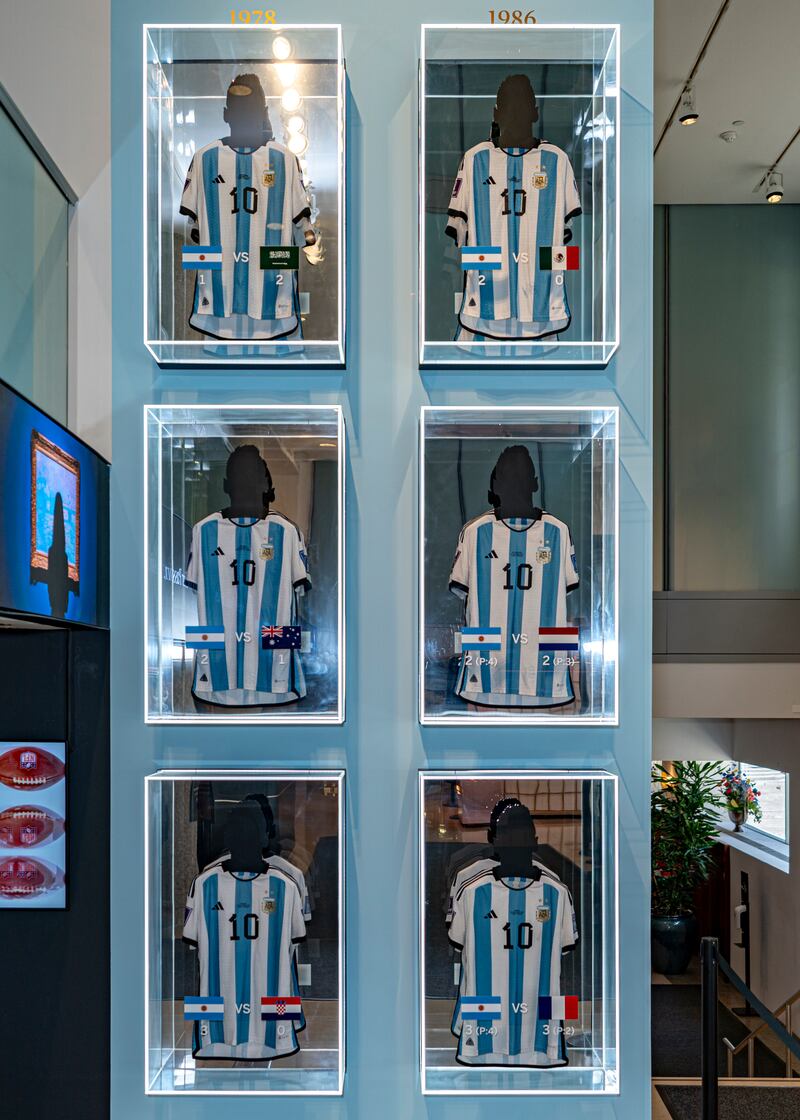 A collection of six shirts, worn by footballer Lionel Messi at the 2022 Fifa World Cup, on display at Sotheby’s in New York (Peter K Afriyie/AP)