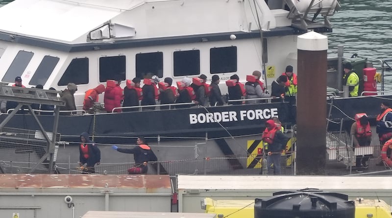 A group of people thought to be migrants are brought in to Dover, Kent, from a Border Force vessel following a small boat incident in the Channel