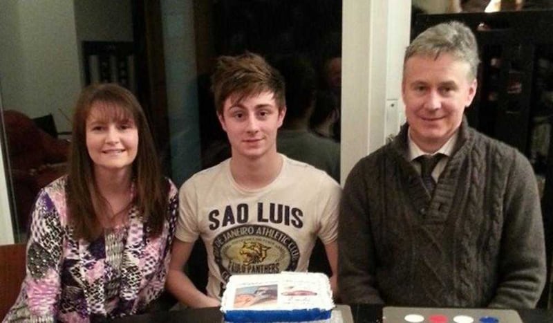 Enda Dolan with his parents Niamh and Peter celebrating his 18th birthday 