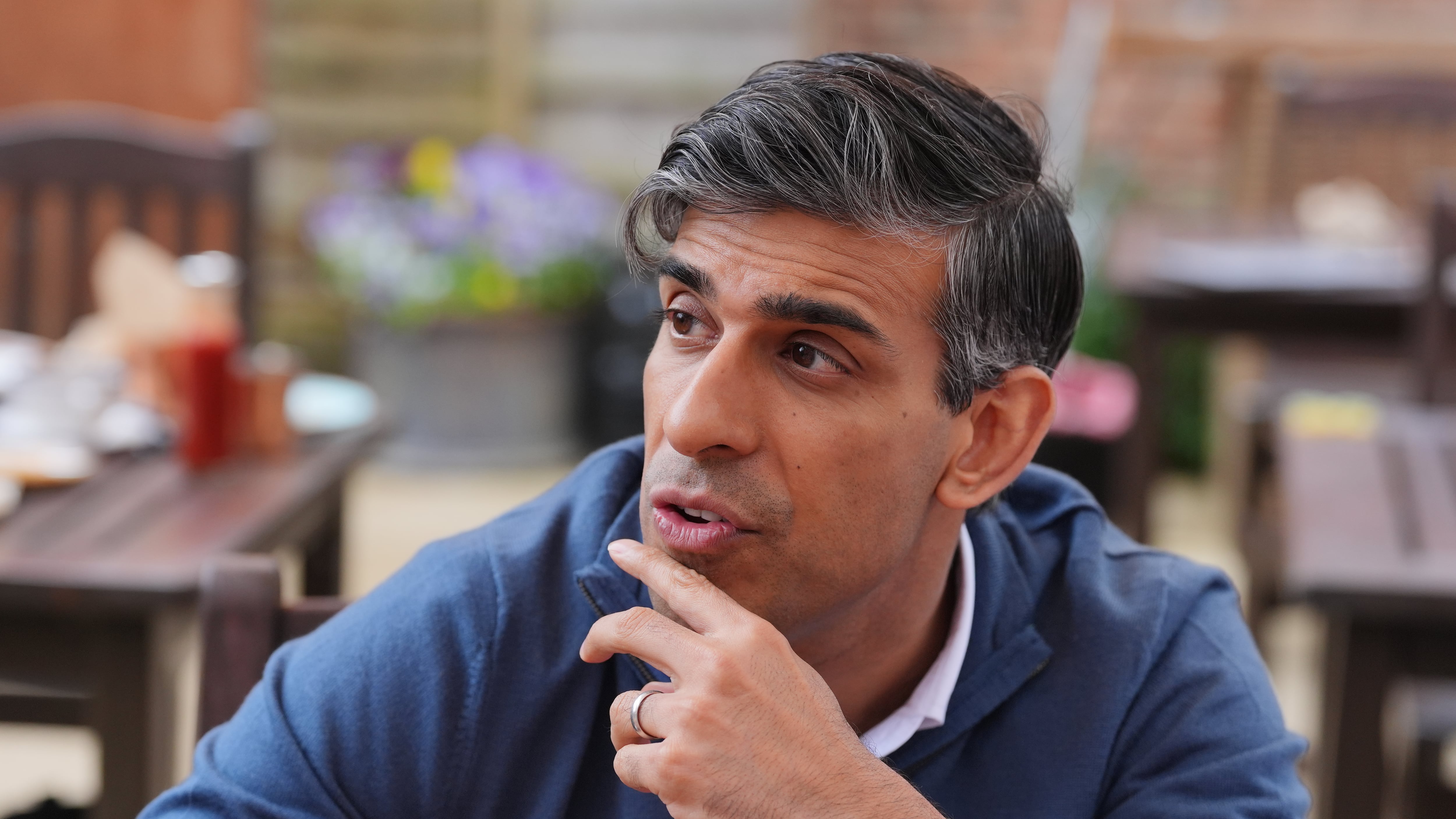Prime Minister Rishi Sunak speaking to staff in a cafe during a visit to Wykham Park Farm in Banbury, Oxfordshire
