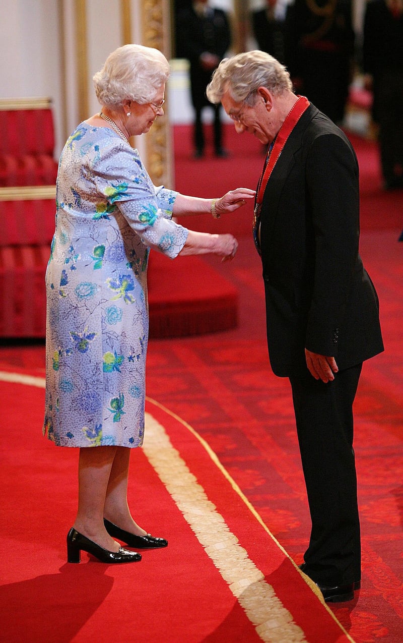 Sir Ian McKellen receives a Companion of Honour medal for services to Drama and Equality from Queen Elizabeth II at Buckingham Palace