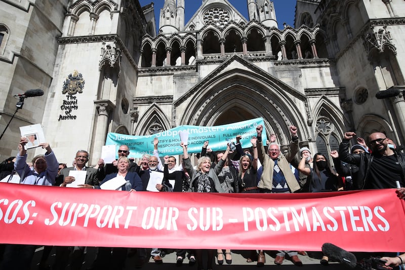 Former post office workers celebrate outside the Royal Courts of Justice, London, after having their convictions overturned by the Court of Appeal