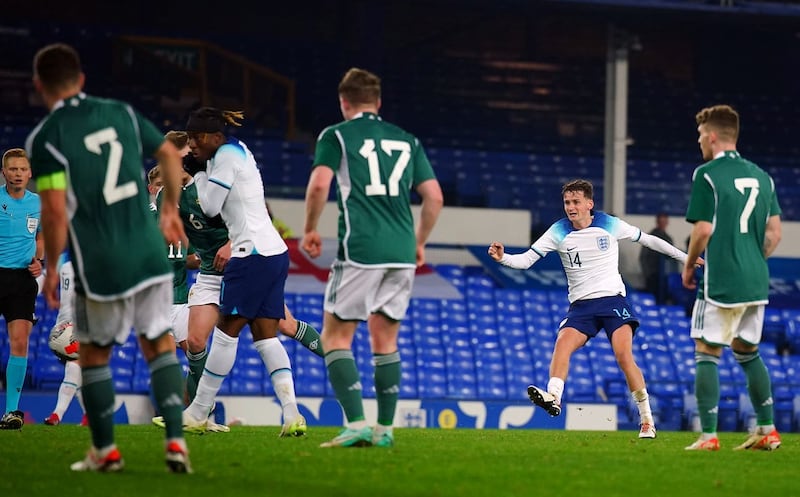 Tyler Morton, second right, scores England’s first goal