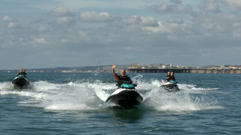 Liberal Democrat leader Sir Ed Davey jet skis into his party’s conference in Brighton on Saturday