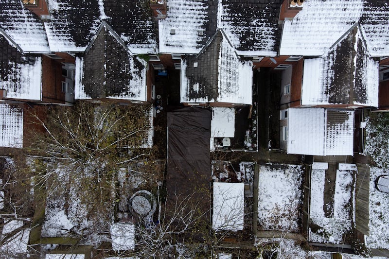 The couple’s back garden covered by plastic sheeting in December 2022