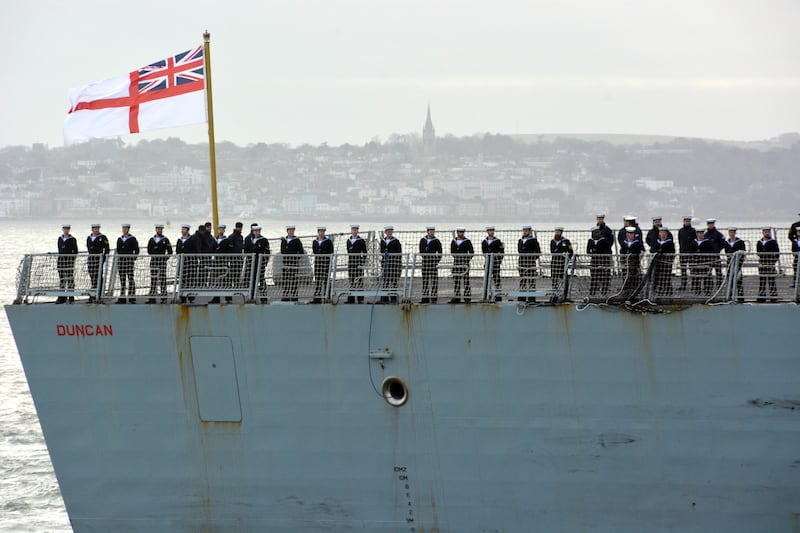 Sailors line the deck of HMS Duncan