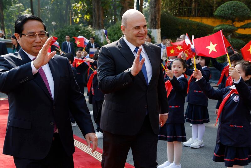 Vietnamese Prime Minister Pham Minh Chinh and his Russian counterpart, Mikhail Mishustin, attend a welcome ceremony in Hanoi (Dmitry Astakhov/Sputnik/Government Pool/AP)