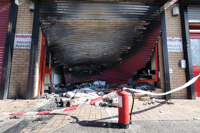 A car was driven into the Welcome Centre on Townsend Street and set on fire. PICTURE: MAL MCCANN