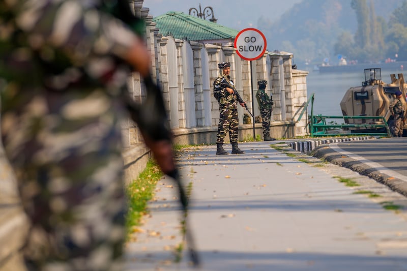 Paramilitary soldiers stand guard outside the venue of swearing in ceremony of ministers of Kashmir’s local government on the outskirts of Srinagar, Indian controlled Kashmir (Dar Yasin/AP)