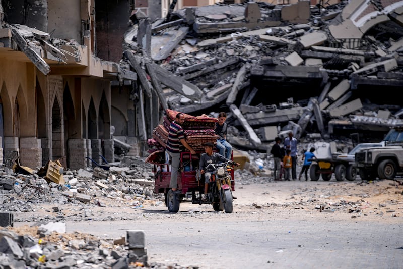 Palestinians leave with what they can carry (Abdel Kareem Hana/AP)