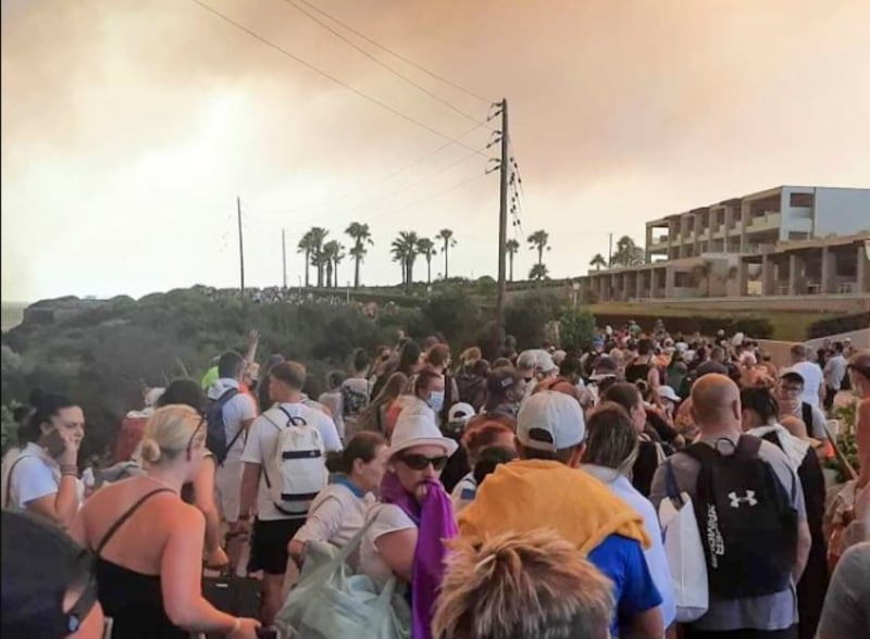 Tourists are being evacuated during a forest fire on the island of Rhodes. Picture by Rhodes.Rodos via AP