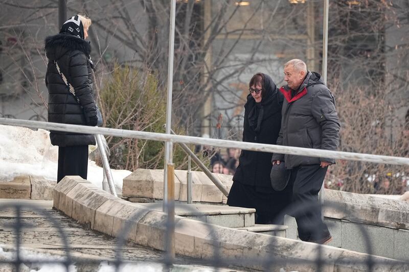 Alexei Navalny’s parents Anatoly Navalny and Lyudmila Navalnaya, walk to the church (AP)