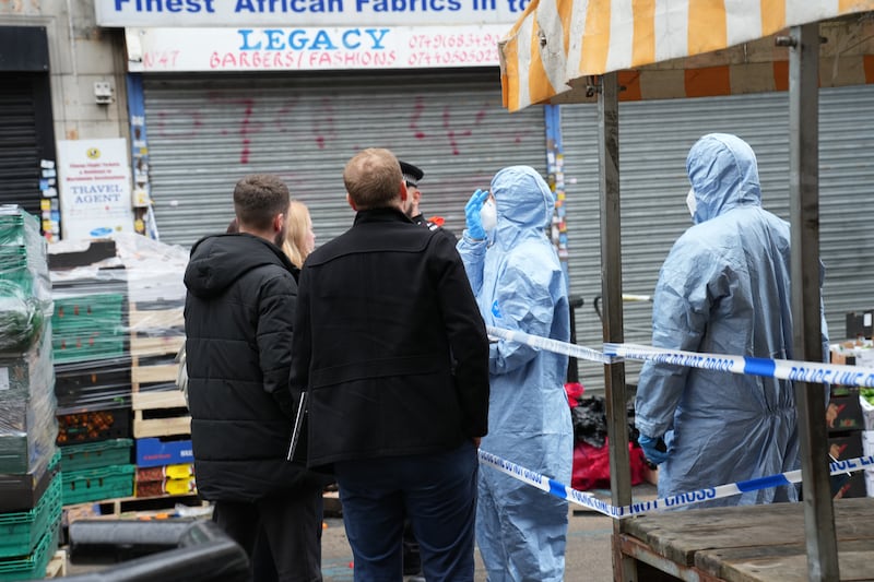 Forensic officers at work in East Street