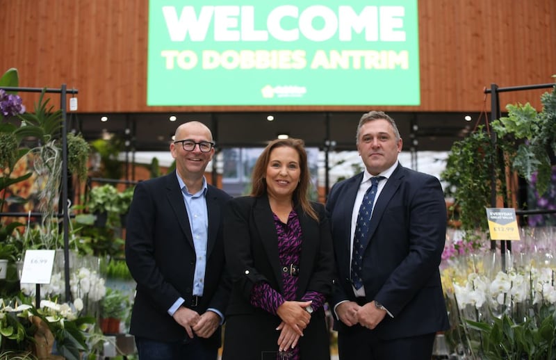 Dobbies chief executive, David Robinson (left), attending the Ocotber 2023 opening of the garden centre chain’s new Antrim store, alongside Julie Cherry of supplier Musgrave NI and Alastair Coulson, managing director at Lotus Property.