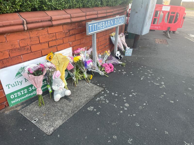 Flowers near the scene in Hart Street, Southport, on Tuesday