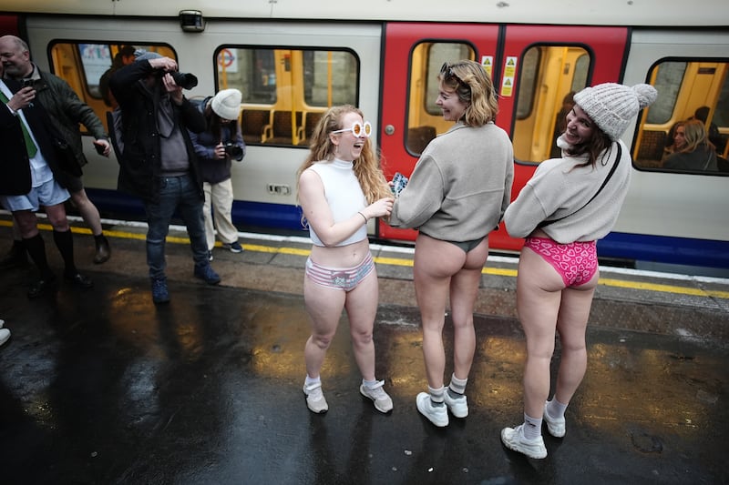 Women display their colourful knickers as part of the annual No Trousers Tube Ride in London