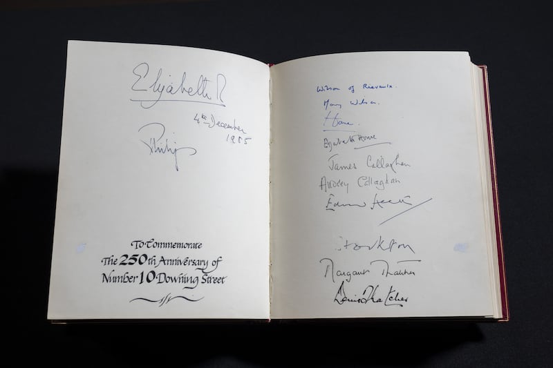 The pages marking the 250th anniversary of Downing Street with signatures of the Queen, Prince Philip, the Wilsons, the Humes, the Callaghans, Edward Heath, the Earl of Stockton, and Margaret and Denis Thatcher